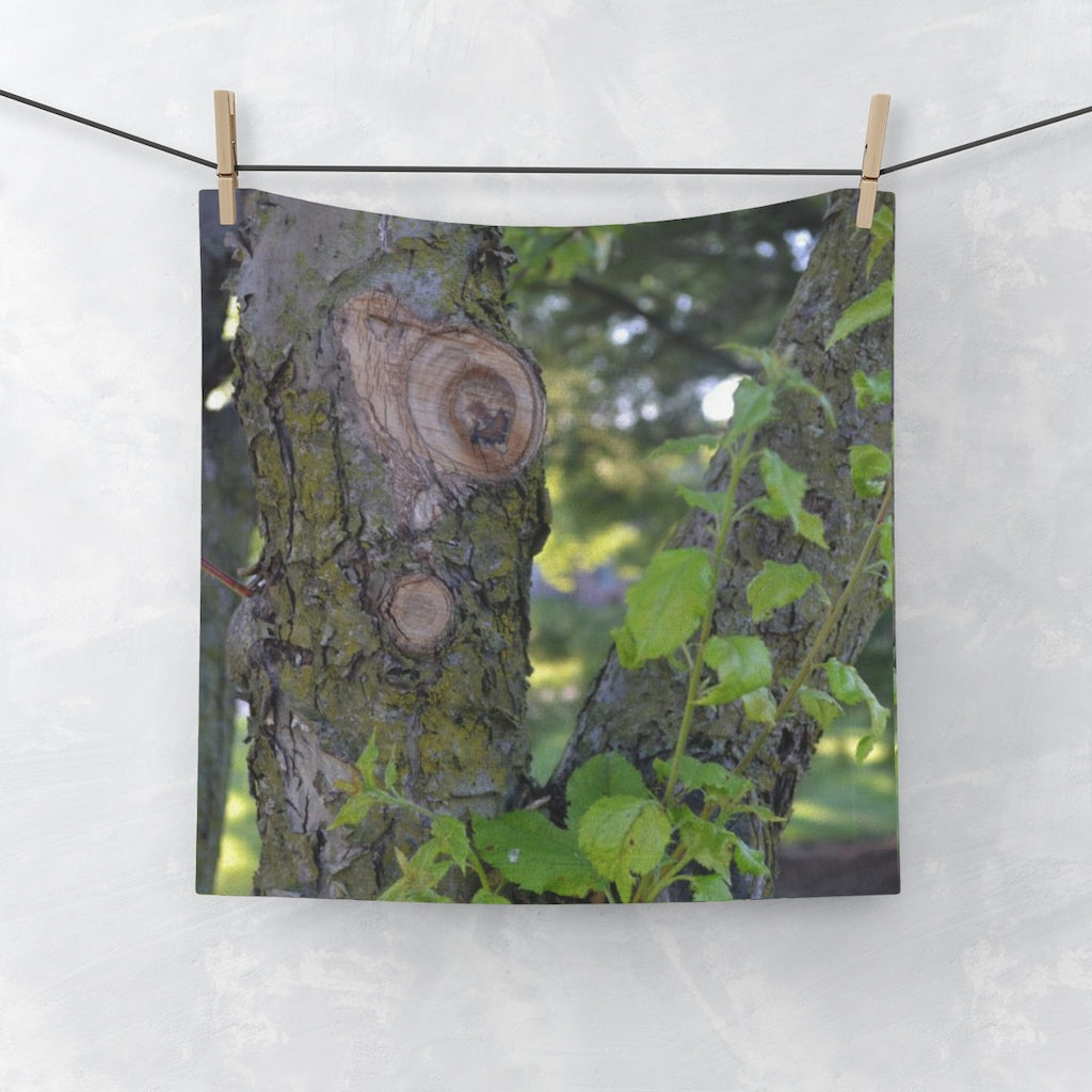 Tree Stump and Green Leaves Face Towel featuring a vibrant printed front and soft cotton back, ideal for personalizing your bathroom.