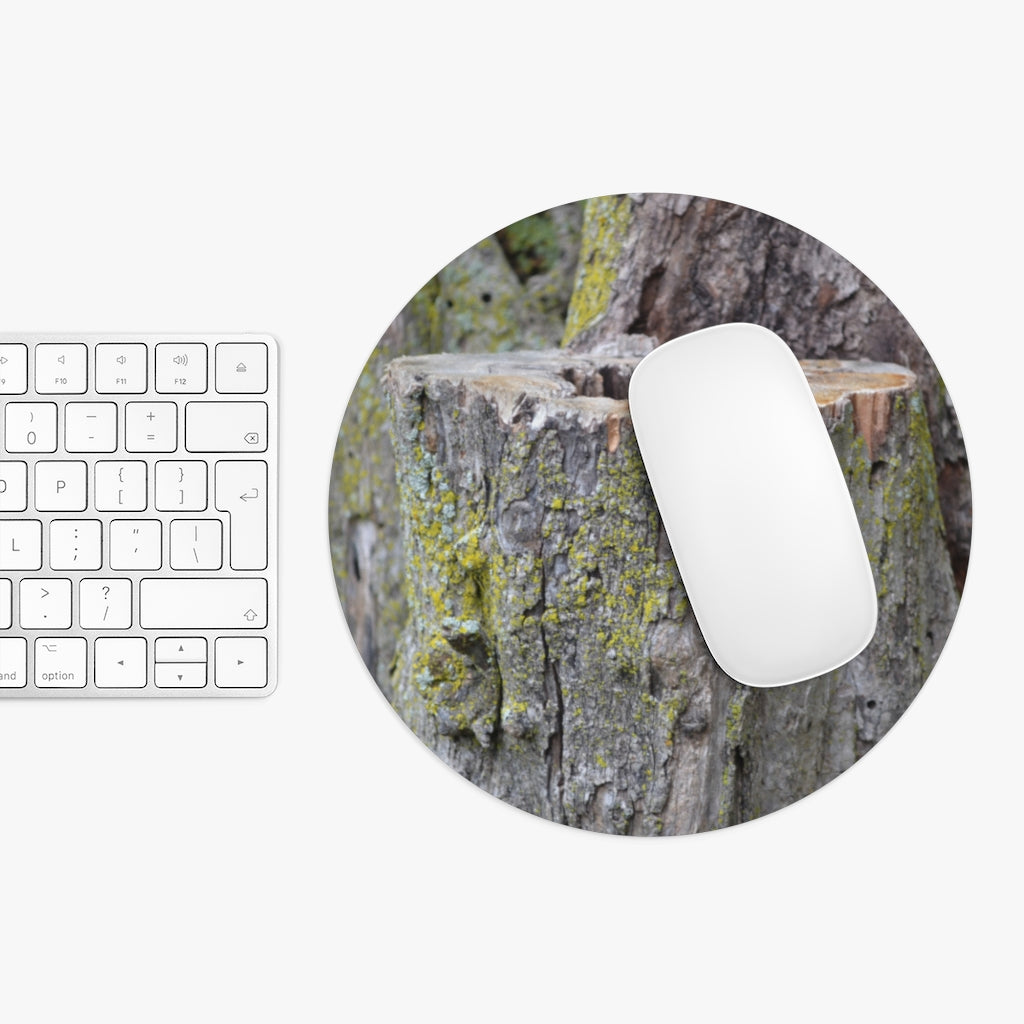 Tree Stump Mouse Pad featuring a vibrant tree stump design with a non-slip rubber bottom, available in round and rectangular shapes.