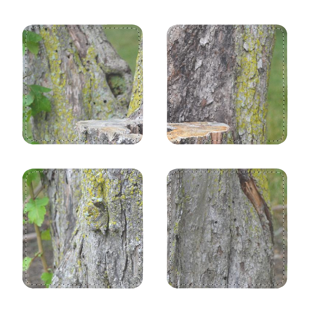 Pack of four Tree Stump Sublimation Coasters made from PU leather, featuring a white printable face and elegant white stitching.