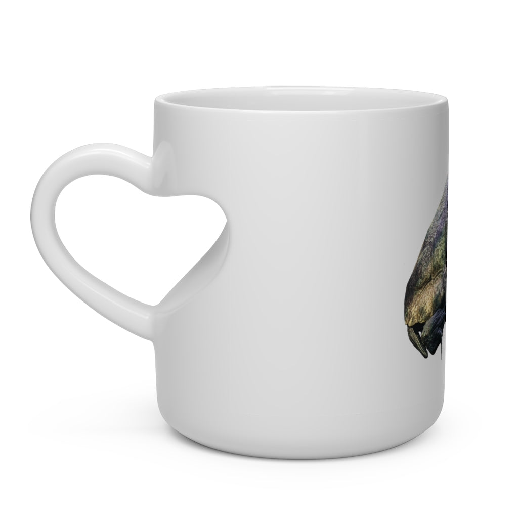 A white ceramic mug shaped like a heart with a heart-shaped handle, perfect for hot beverages.