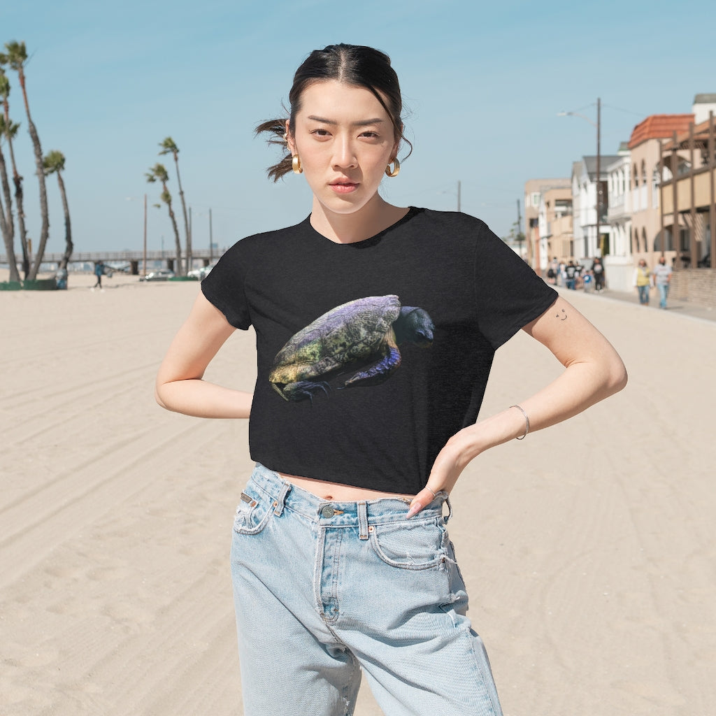 Turtle Women's Flowy Cropped Tee in various colors, showcasing its soft fabric and stylish design.