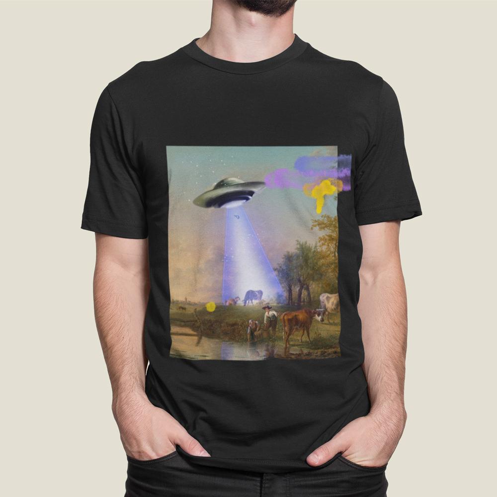 A soft cotton t-shirt featuring a whimsical graphic of a UFO abducting a cow, perfect for casual wear.