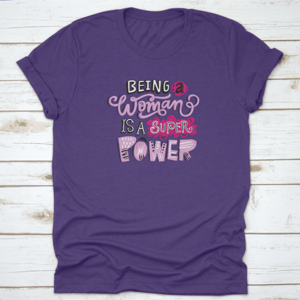 Unique hand-drawn lettering quote t-shirt featuring the phrase 'Being A Woman Is A', showcasing its stylish design and comfortable fit.