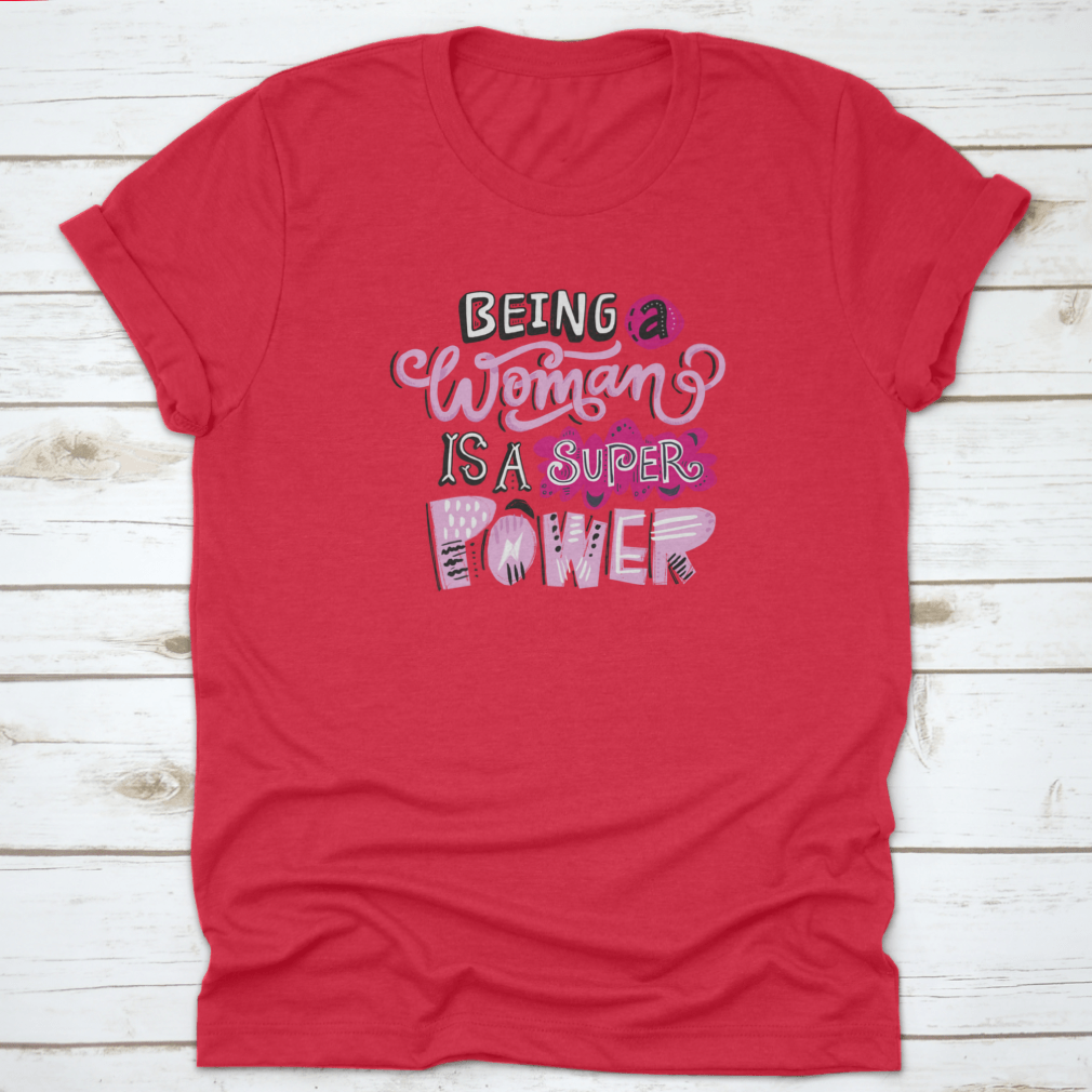 Unique hand-drawn lettering quote t-shirt featuring the phrase 'Being A Woman Is A', showcasing its stylish design and comfortable fit.