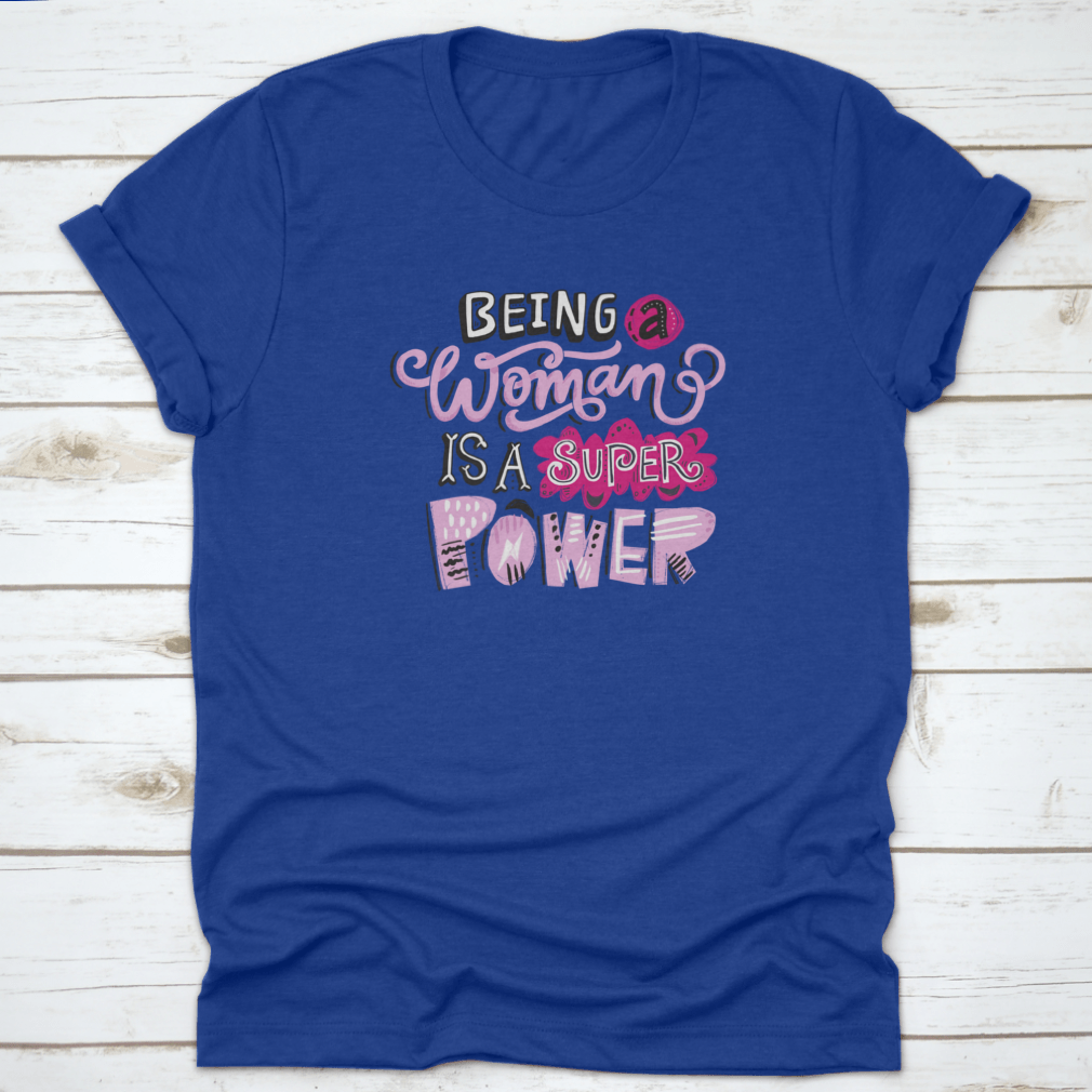 Unique hand-drawn lettering quote t-shirt featuring the phrase 'Being A Woman Is A', showcasing its stylish design and comfortable fit.