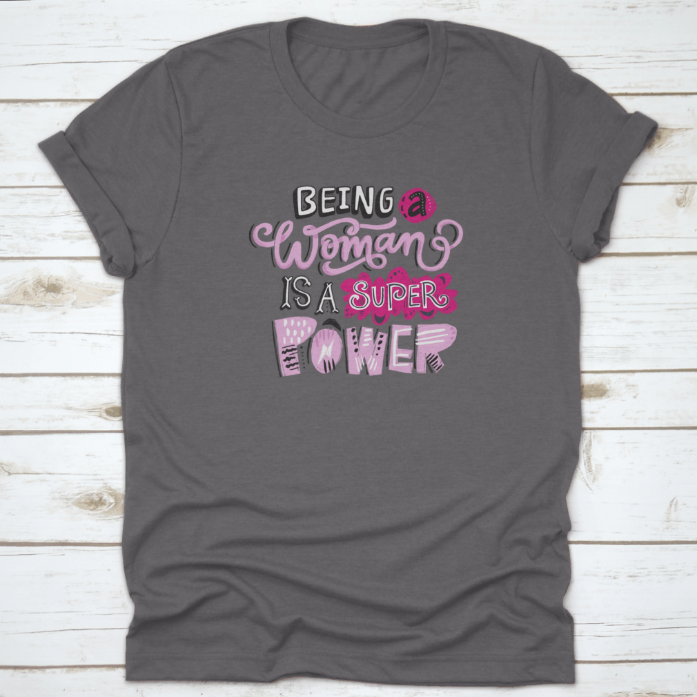 Unique hand-drawn lettering quote t-shirt featuring the phrase 'Being A Woman Is A', showcasing its stylish design and comfortable fit.