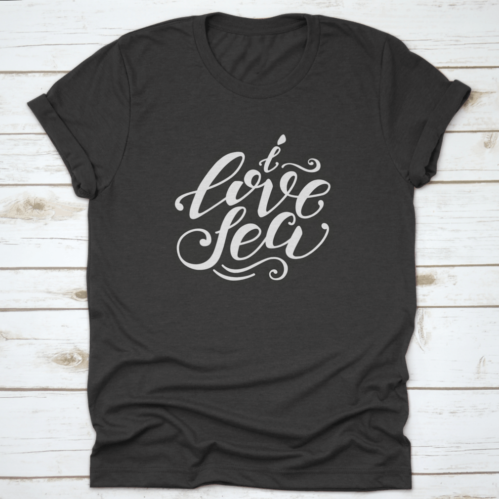 A stylish 'I Love Sea' T-shirt featuring vector hand-drawn lettering, made from soft cotton fabric, perfect for casual wear.