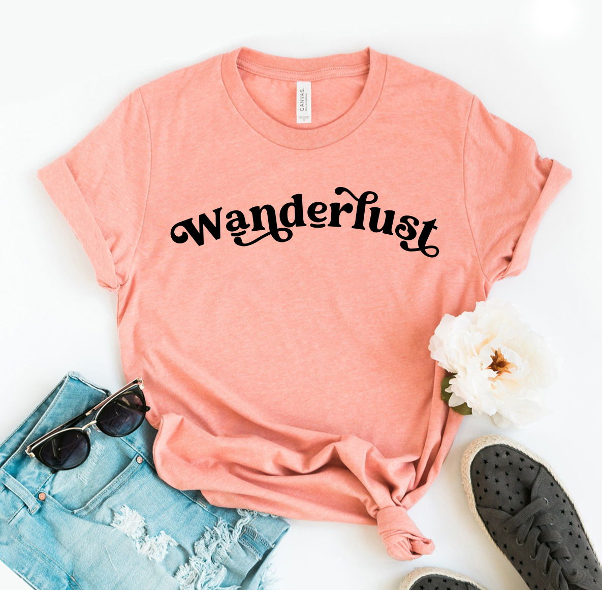 Wanderlust T-shirt made of premium ring spun cotton, featuring a soft feel and vibrant flex print design, available in various sizes.