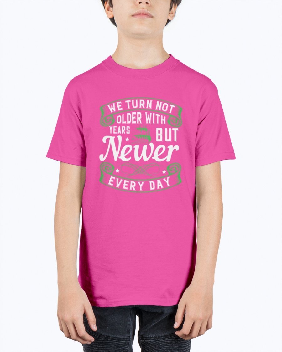 A stylish unisex birthday t-shirt featuring the quote 'We turn not older with years, but newer every day' in a vibrant design.