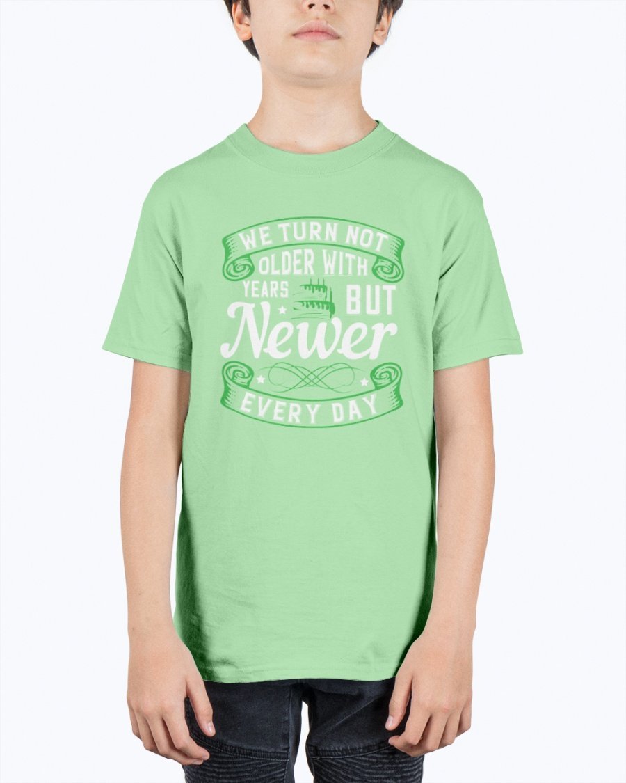 A stylish unisex birthday t-shirt featuring the quote 'We turn not older with years, but newer every day' in a vibrant design.
