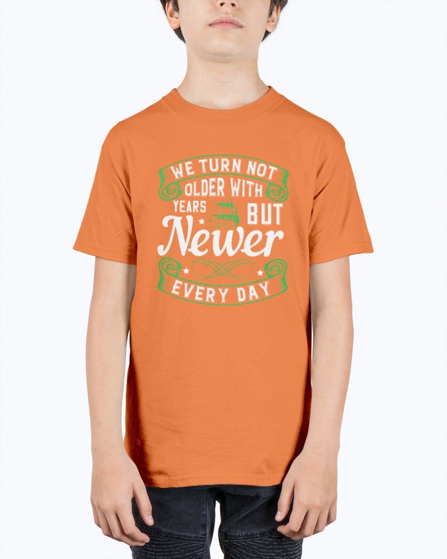 A stylish unisex birthday t-shirt featuring the quote 'We turn not older with years, but newer every day' in a vibrant design.