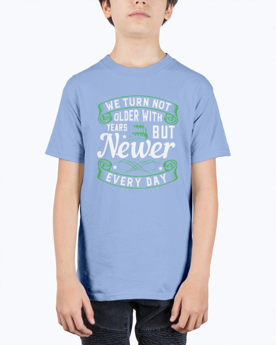 A stylish unisex birthday t-shirt featuring the quote 'We turn not older with years, but newer every day' in a vibrant design.