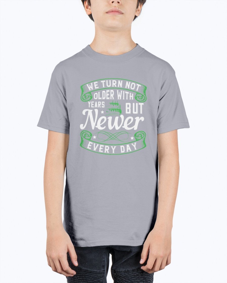 A stylish unisex birthday t-shirt featuring the quote 'We turn not older with years, but newer every day' in a vibrant design.