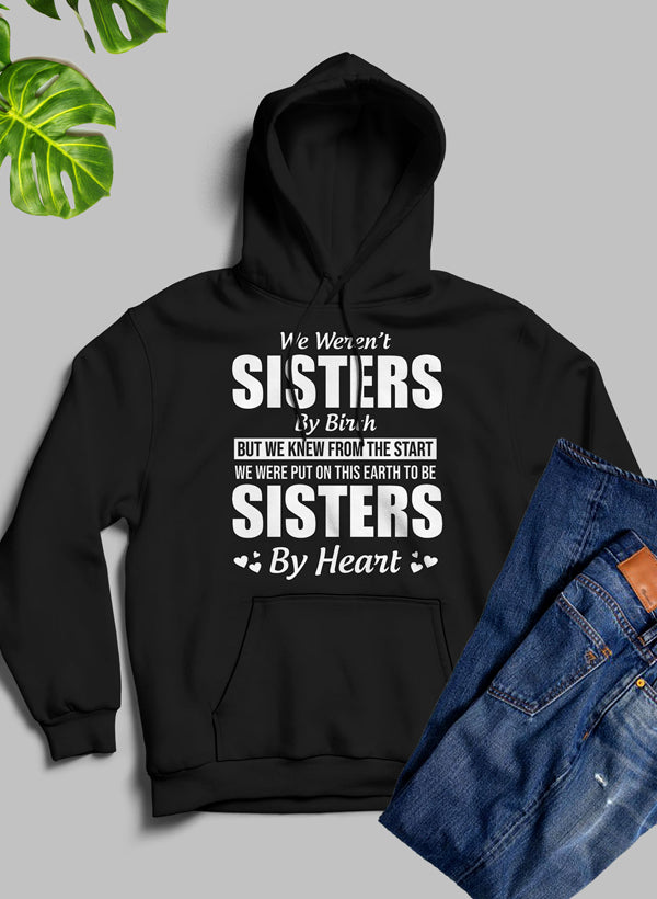 We Weren't Sisters By Birth Hoodie featuring a cozy fleece blend, adjustable hood, and unique artistic design.