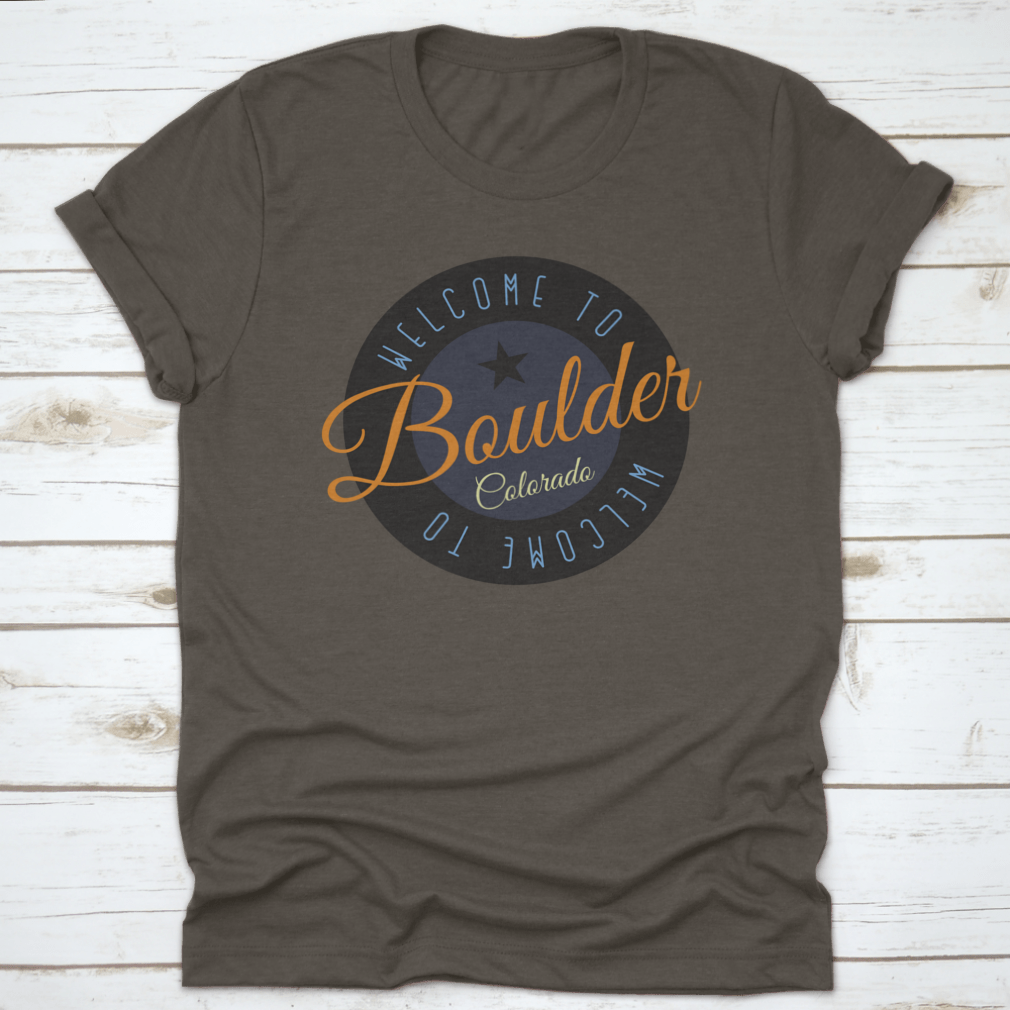 A stylish cotton shirt featuring the phrase 'Welcome To Boulder Colorado' with scenic designs, perfect for tourists and locals.
