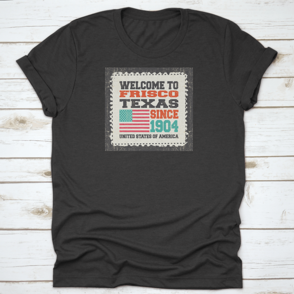 A classic t-shirt featuring the American flag and the text 'Welcome To Frisco, State Texas. Since 1904', made from high-quality cotton.