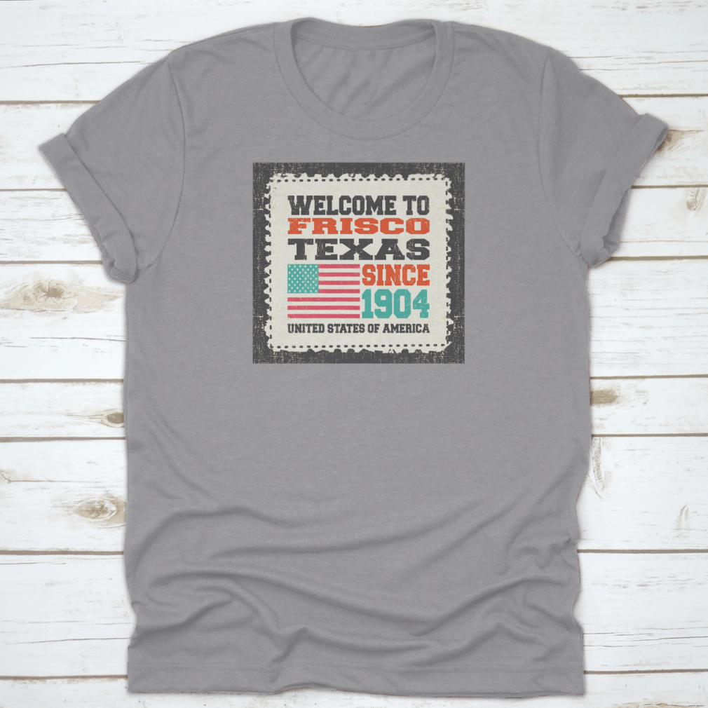 A classic t-shirt featuring the American flag and the text 'Welcome To Frisco, State Texas. Since 1904', made from high-quality cotton.