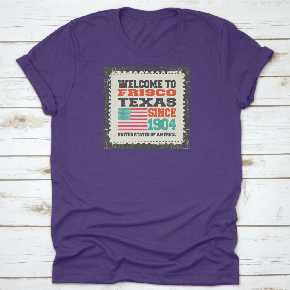 A classic t-shirt featuring the American flag and the text 'Welcome To Frisco, State Texas. Since 1904', made from high-quality cotton.