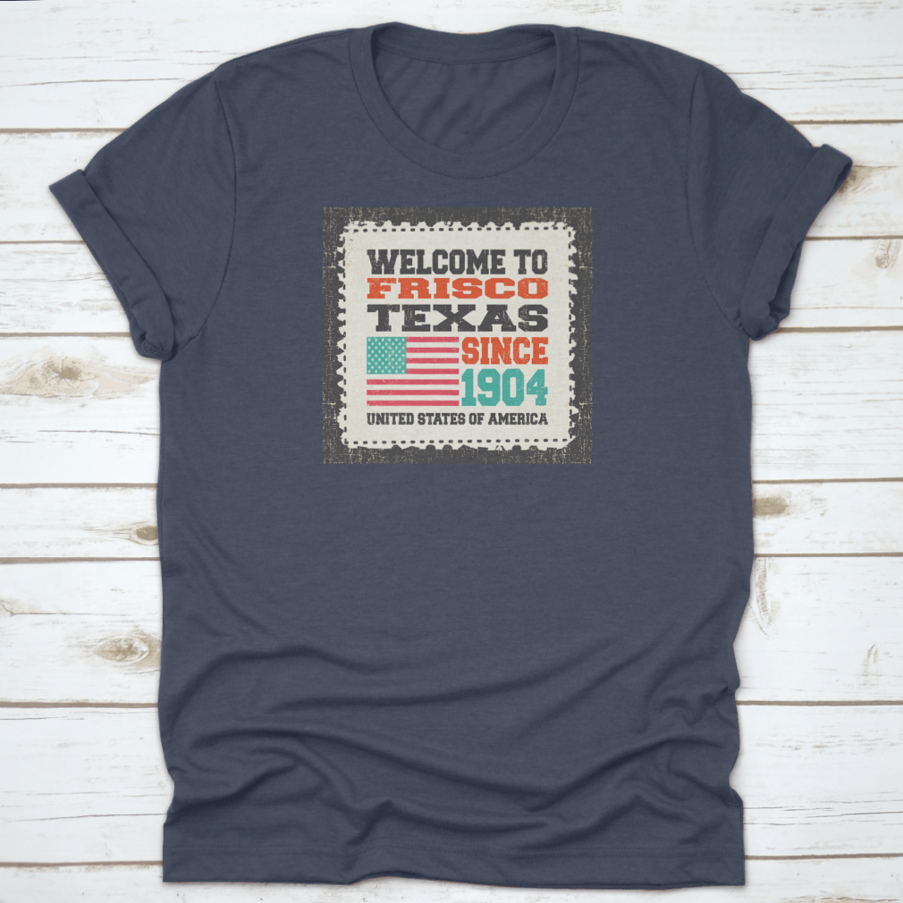 A classic t-shirt featuring the American flag and the text 'Welcome To Frisco, State Texas. Since 1904', made from high-quality cotton.