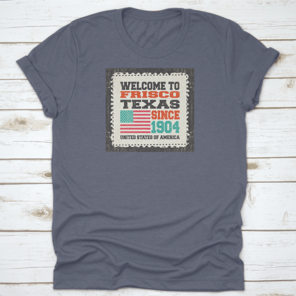 A classic t-shirt featuring the American flag and the text 'Welcome To Frisco, State Texas. Since 1904', made from high-quality cotton.
