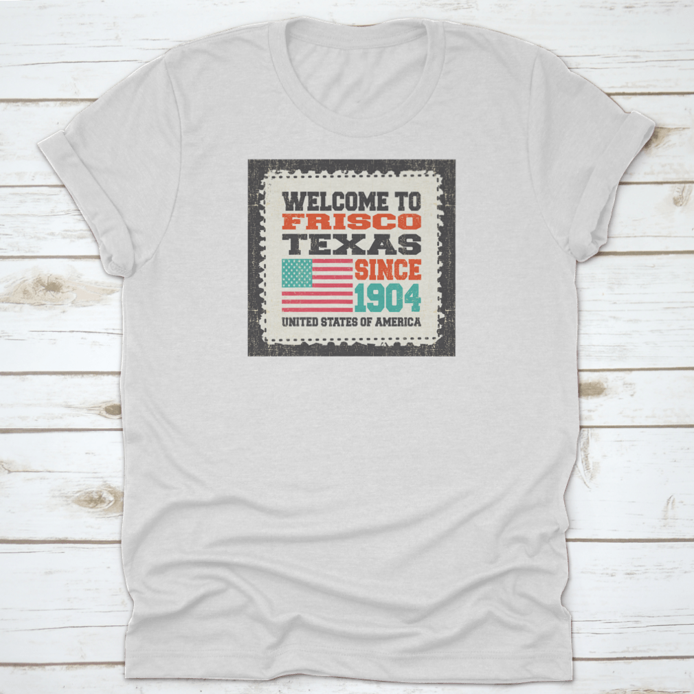 A classic t-shirt featuring the American flag and the text 'Welcome To Frisco, State Texas. Since 1904', made from high-quality cotton.