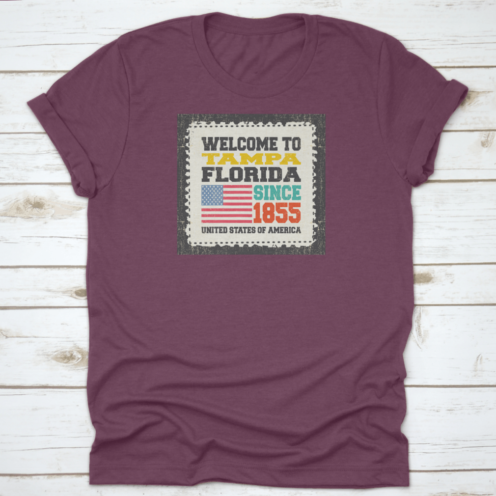 A classic cotton t-shirt featuring the phrase 'Welcome To Tampa, State Florida. Since 1855' with an American flag design.