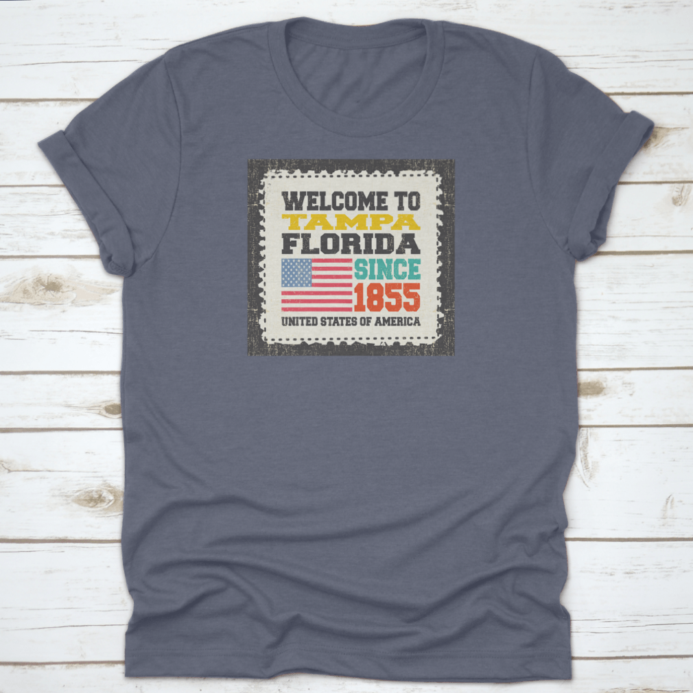 A classic cotton t-shirt featuring the phrase 'Welcome To Tampa, State Florida. Since 1855' with an American flag design.