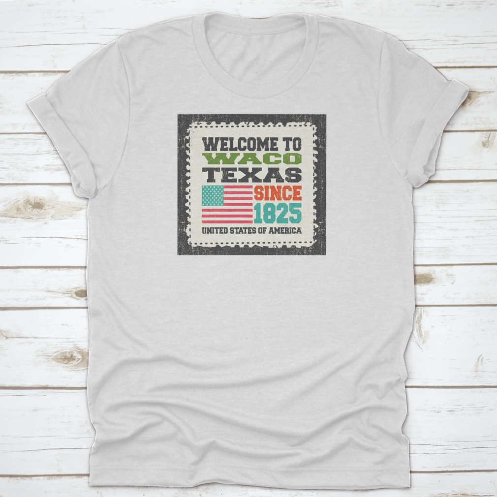 A stylish cotton t-shirt featuring the phrase 'Welcome To Waco State Texas Since 1825' with an American flag design, perfect for travel enthusiasts.
