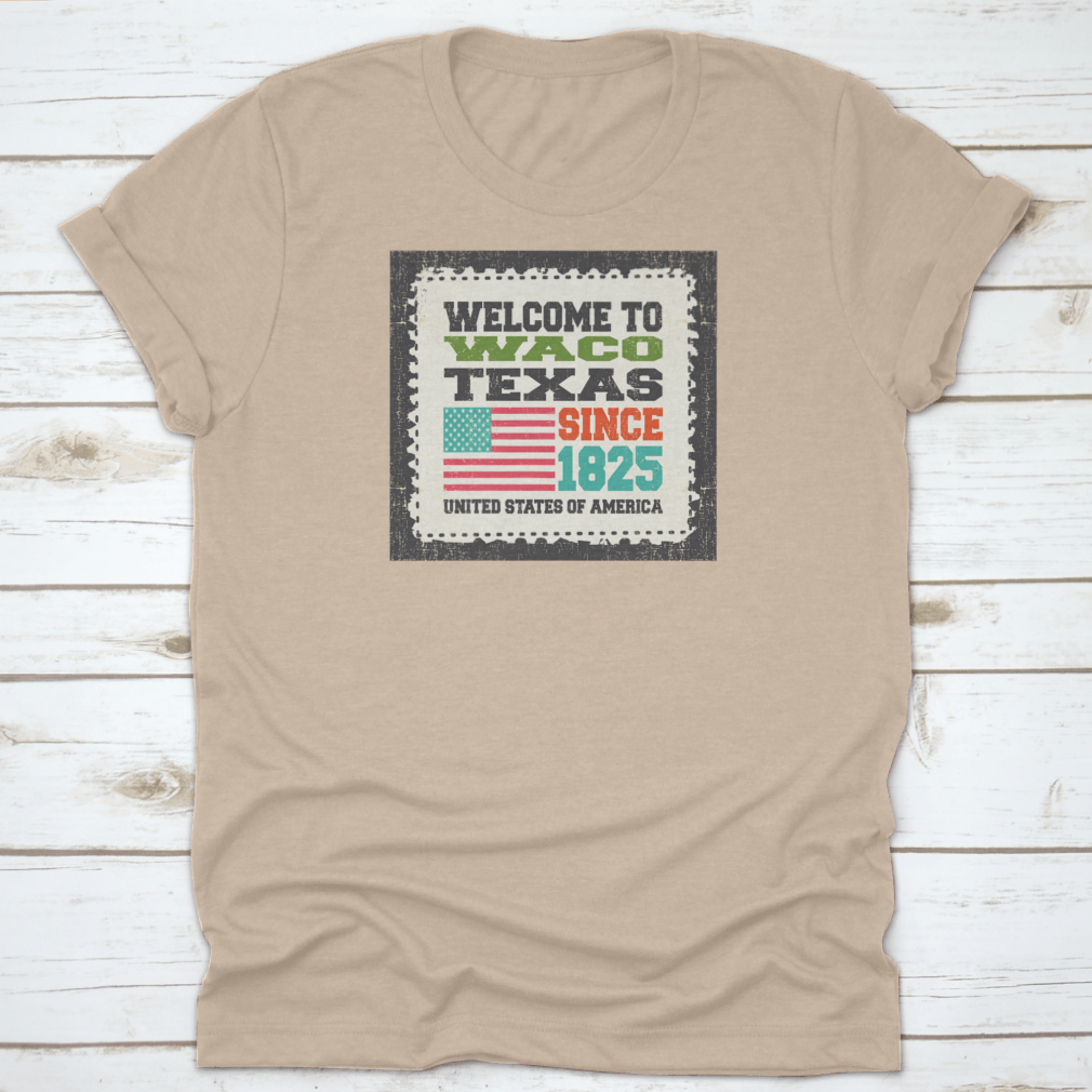 A stylish cotton t-shirt featuring the phrase 'Welcome To Waco State Texas Since 1825' with an American flag design, perfect for travel enthusiasts.