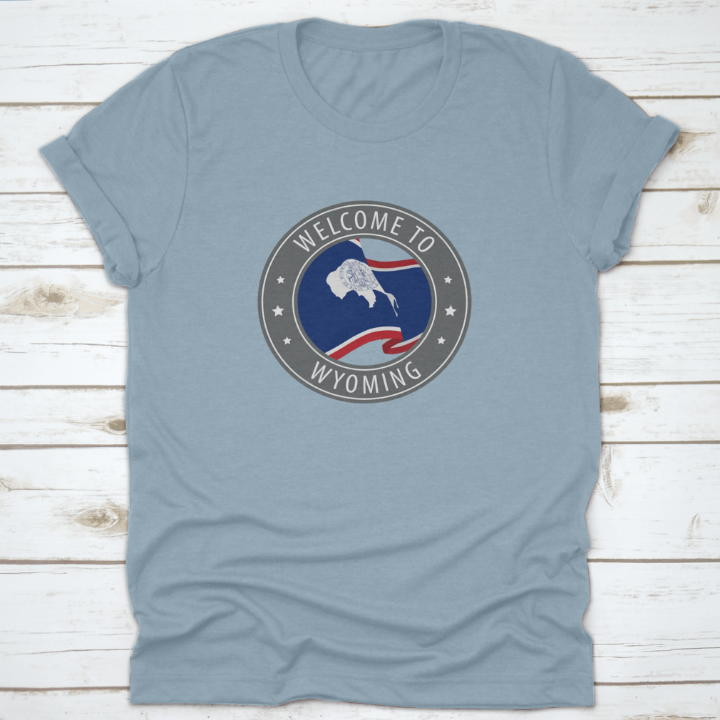 Gray t-shirt featuring a waving Wyoming state flag design, made from 100% cotton for comfort.