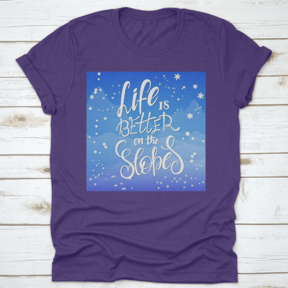 Winter-themed t-shirt featuring snowflakes and mountain flare design, made from soft cotton fabric.