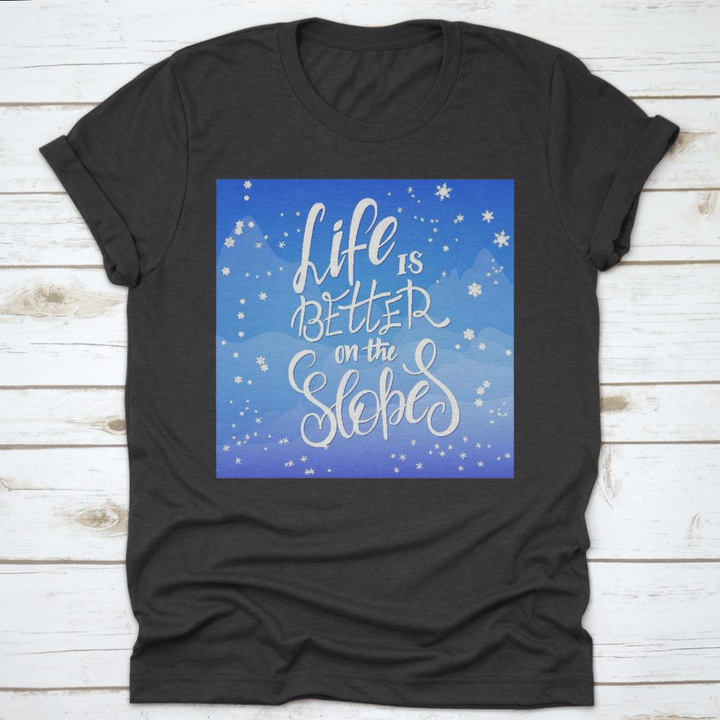 Winter-themed t-shirt featuring snowflakes and mountain flare design, made from soft cotton fabric.