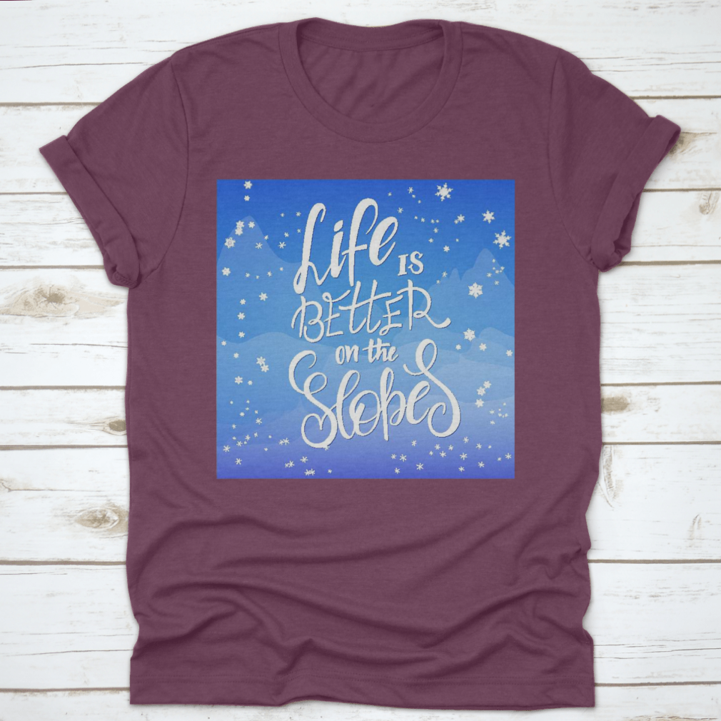 Winter-themed t-shirt featuring snowflakes and mountain flare design, made from soft cotton fabric.