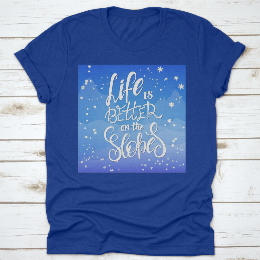 Winter-themed t-shirt featuring snowflakes and mountain flare design, made from soft cotton fabric.