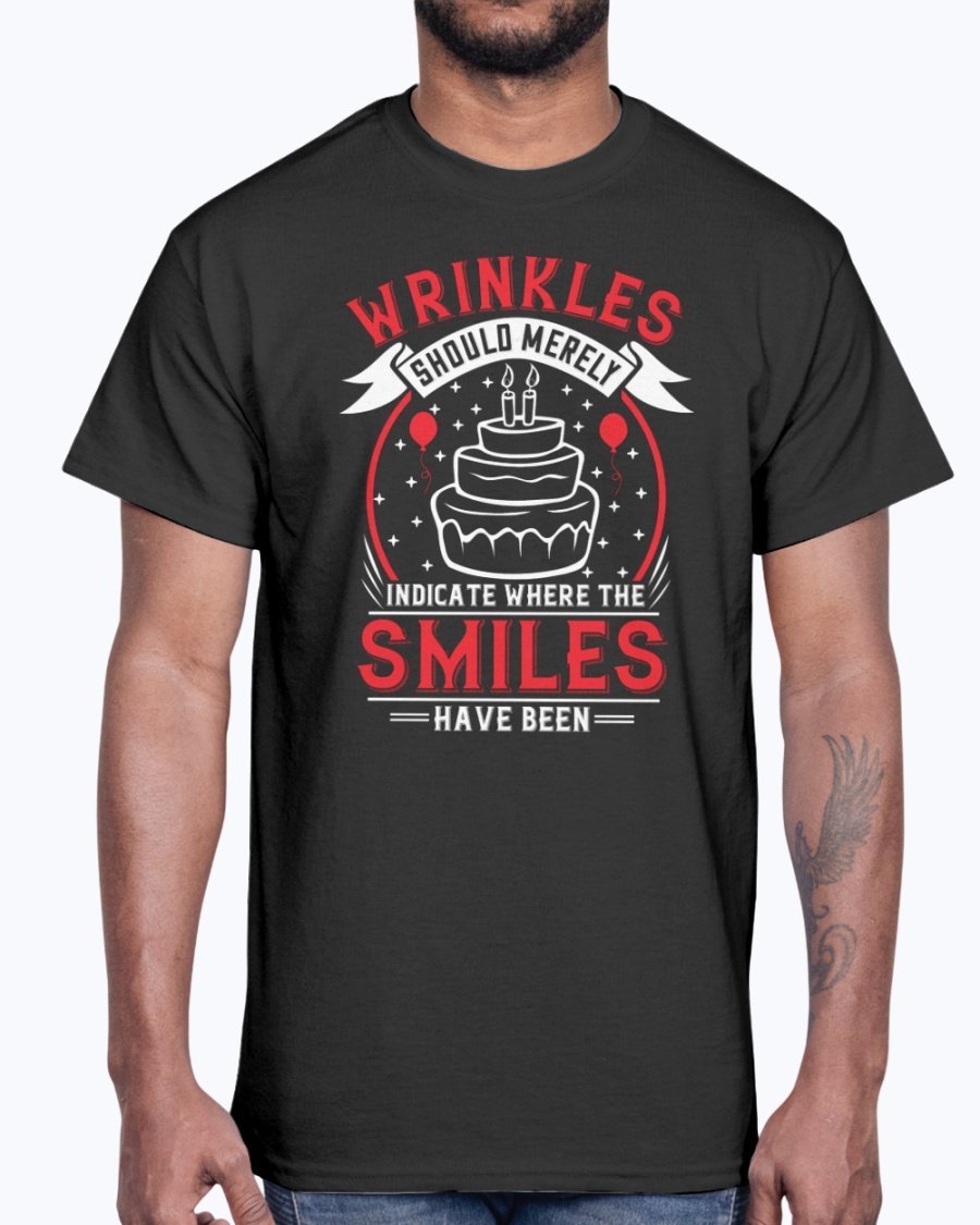 A stylish cotton tee featuring the phrase 'Wrinkles should merely indicate where the smiles have been' in a cheerful font, perfect for birthday celebrations.