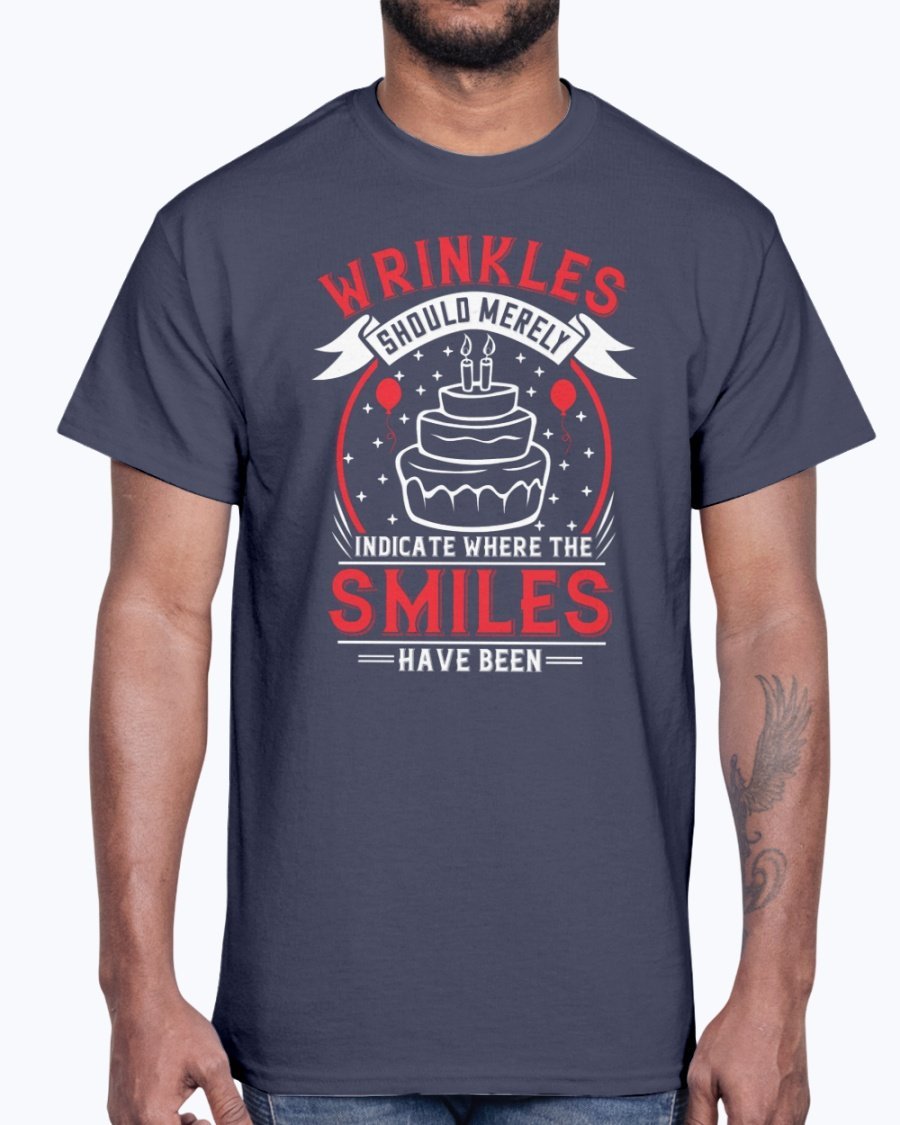 A stylish cotton tee featuring the phrase 'Wrinkles should merely indicate where the smiles have been' in a cheerful font, perfect for birthday celebrations.