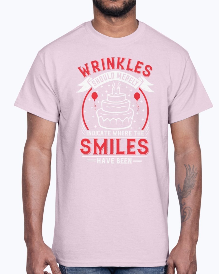A stylish cotton tee featuring the phrase 'Wrinkles should merely indicate where the smiles have been' in a cheerful font, perfect for birthday celebrations.