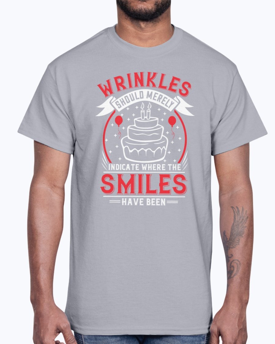 A stylish cotton tee featuring the phrase 'Wrinkles should merely indicate where the smiles have been' in a cheerful font, perfect for birthday celebrations.