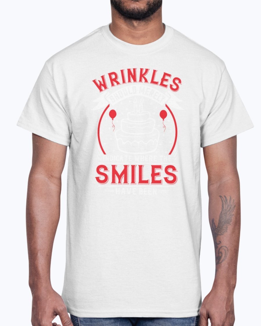 A stylish cotton tee featuring the phrase 'Wrinkles should merely indicate where the smiles have been' in a cheerful font, perfect for birthday celebrations.