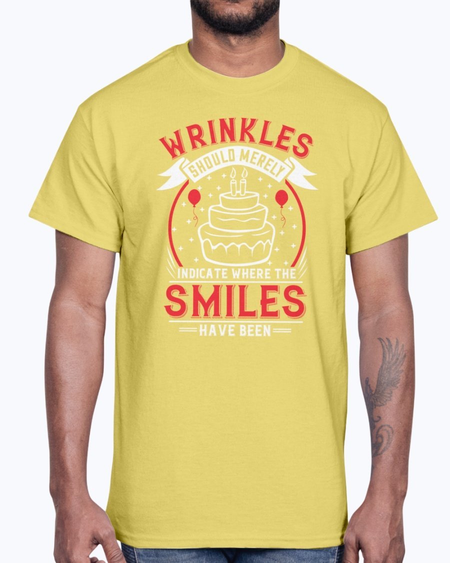 A stylish cotton tee featuring the phrase 'Wrinkles should merely indicate where the smiles have been' in a cheerful font, perfect for birthday celebrations.