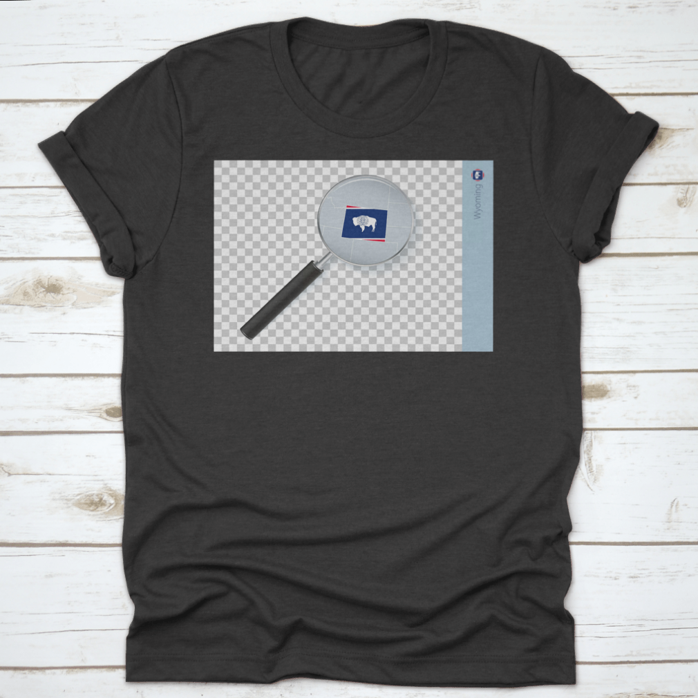 A stylish shirt featuring a Wyoming map and flag design inside a magnifying glass, showcasing state pride.
