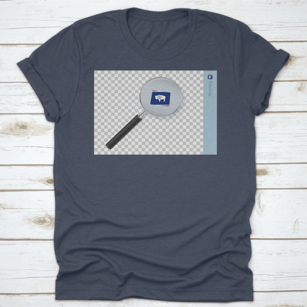 A stylish shirt featuring a Wyoming map and flag design inside a magnifying glass, showcasing state pride.