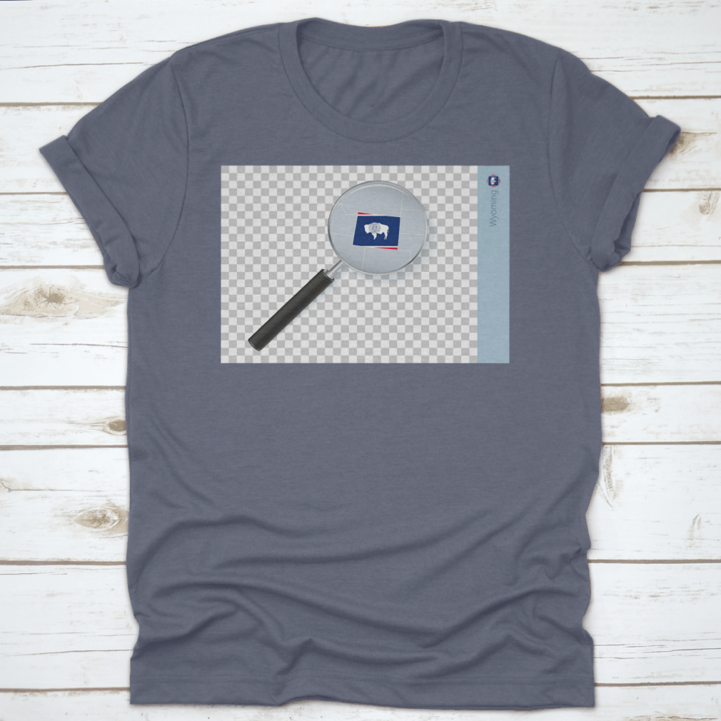 A stylish shirt featuring a Wyoming map and flag design inside a magnifying glass, showcasing state pride.