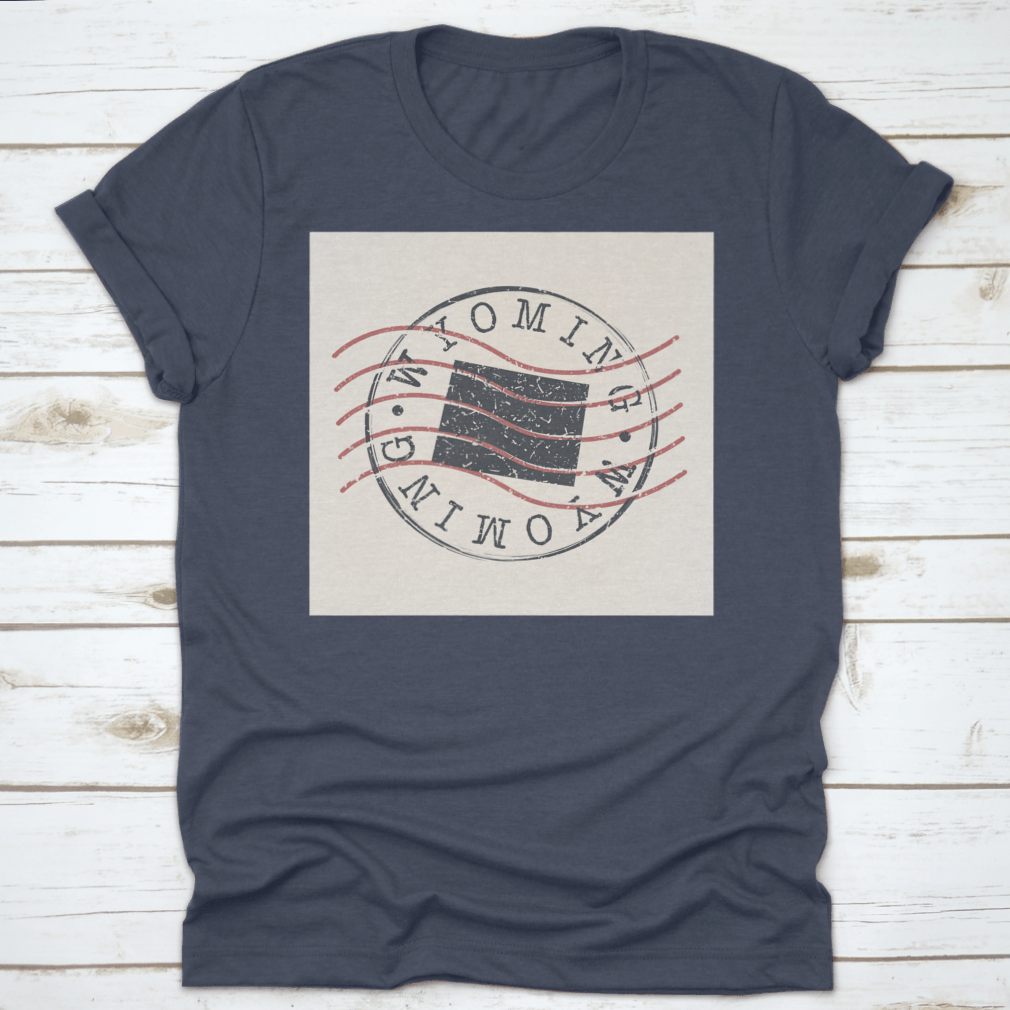 A stylish Wyoming Stamp Postal t-shirt featuring a map silhouette seal design, made from soft cotton fabric.