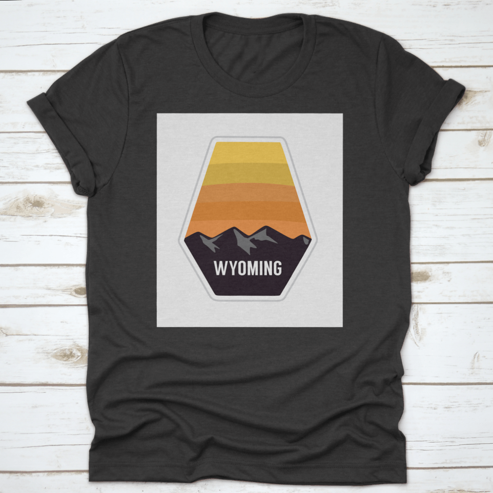 Black travel apparel featuring Wyoming mountain silhouettes, showcasing outdoor adventure and nature.