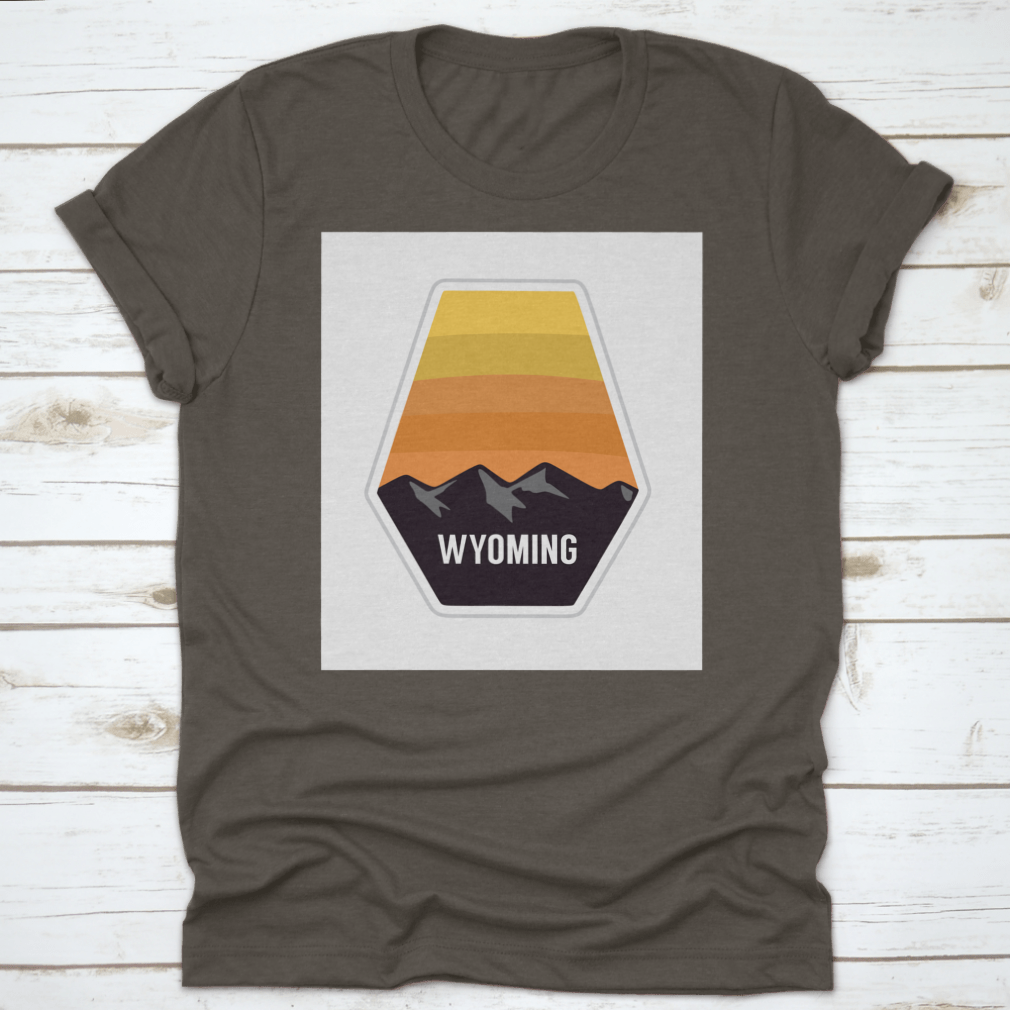 Black travel apparel featuring Wyoming mountain silhouettes, showcasing outdoor adventure and nature.