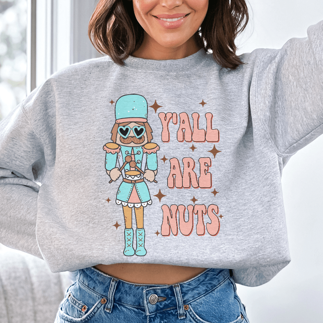 Y'all Are Nuts sweats featuring unique designs by top artists, showcasing a cozy fleece lining and adjustable cuffs.