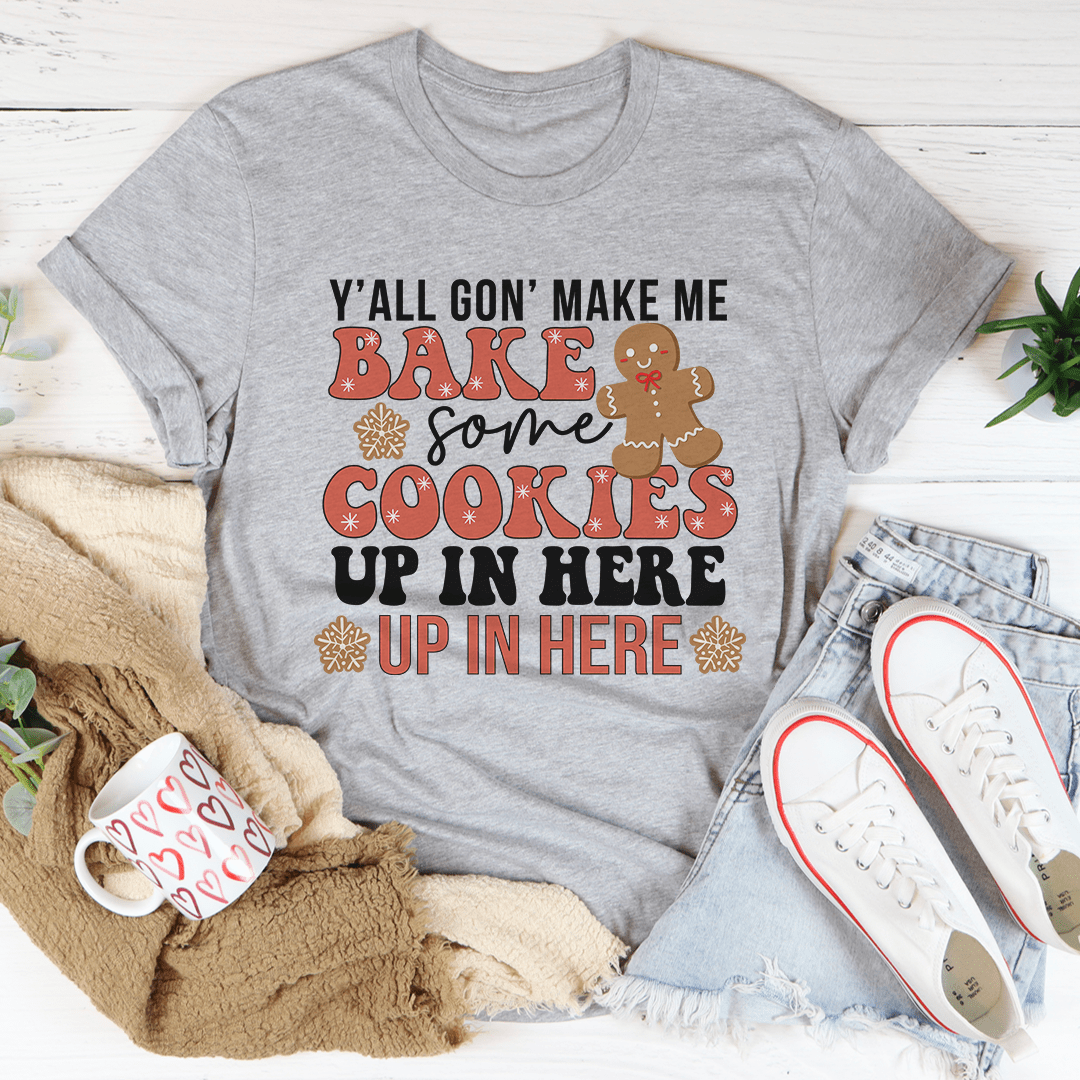 Festive Y'All Gon' Make Me Bake Some Cookies Tee made from 100% soft cotton, featuring vibrant holiday-themed graphics.