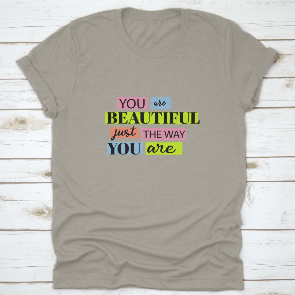 A stylish T-shirt featuring the motivational quote 'You Are Beautiful' in an inspiring design, made from soft cotton fabric.