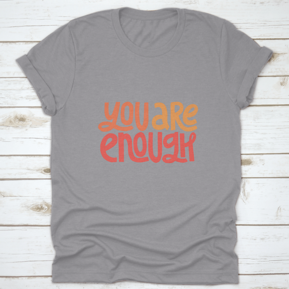 You Are Enough Inspirational Design T-Shirt displayed on a mannequin, showcasing its classic fit and motivational message.